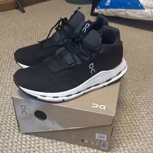 On Running Black and White Sneakers with CloudTec Sole